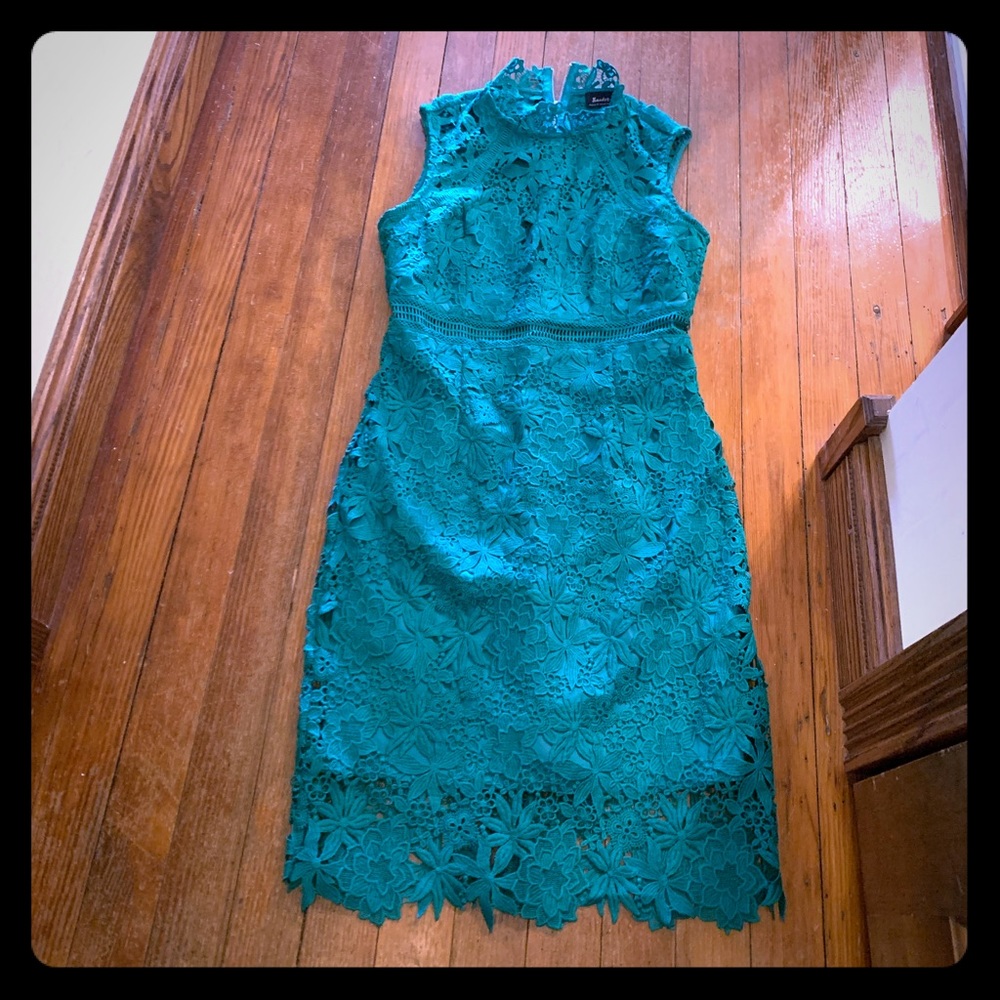 Beautiful green dress with intricate detail.